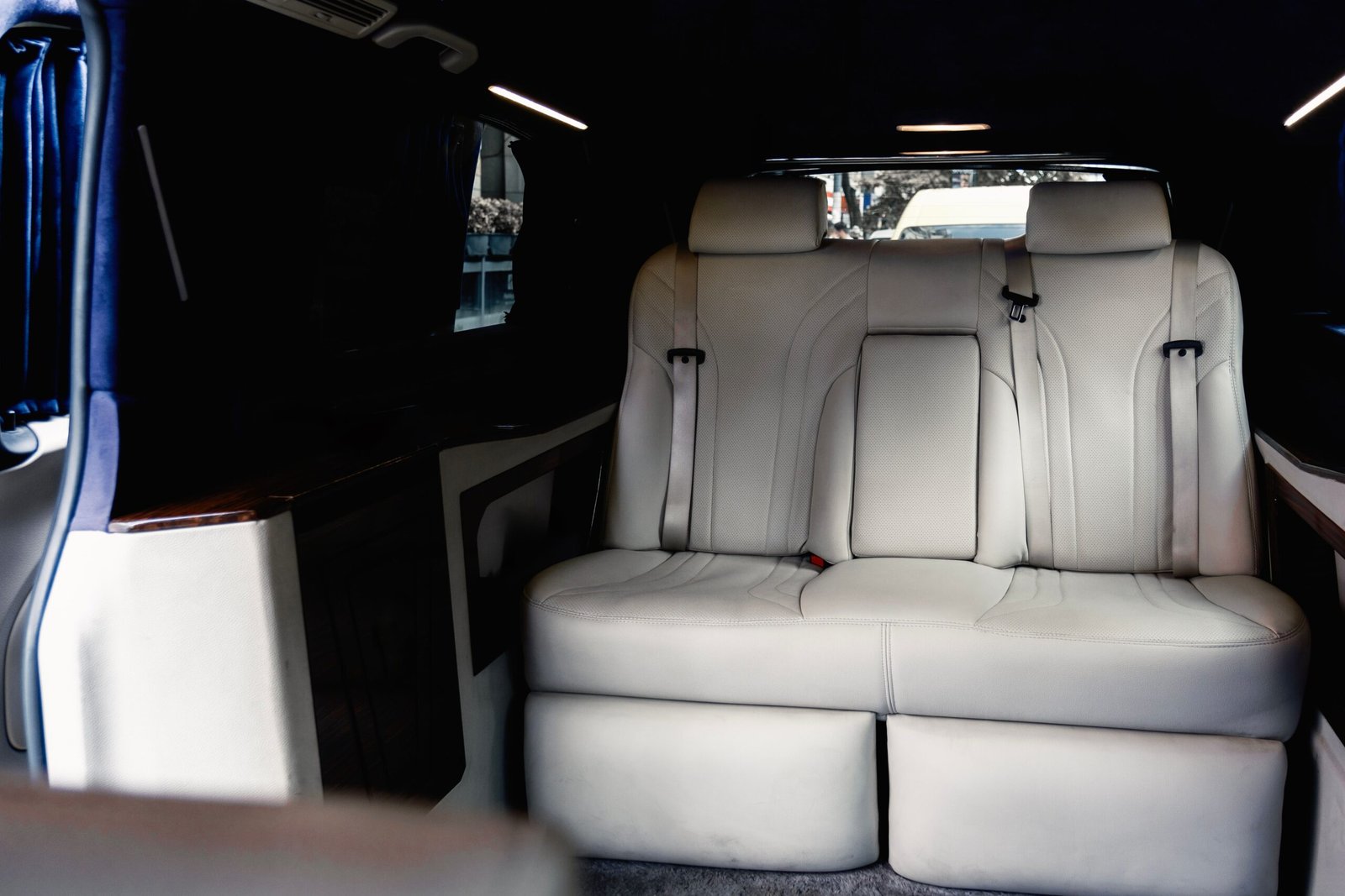 Capture of a spacious and luxurious car interior featuring plush, comfortable seats perfect for travel.